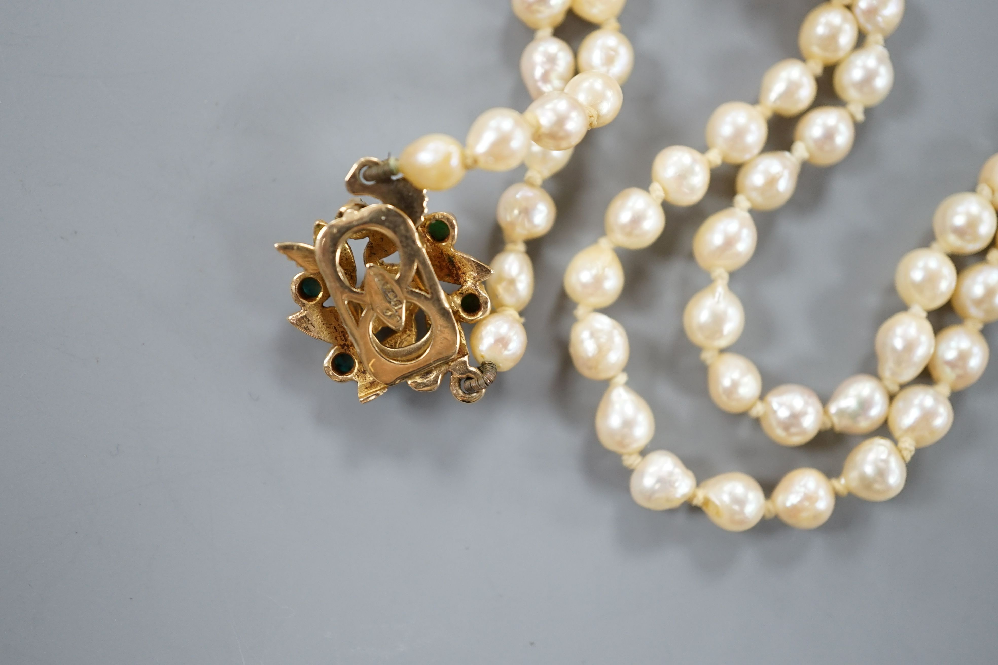 A single strand cultured pearl necklace with turquoise set 9ct gold clasp, 60cm